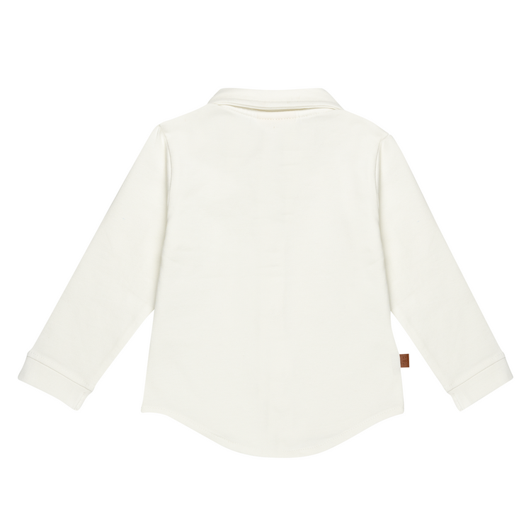 Witte kinderblouse plat gelegd