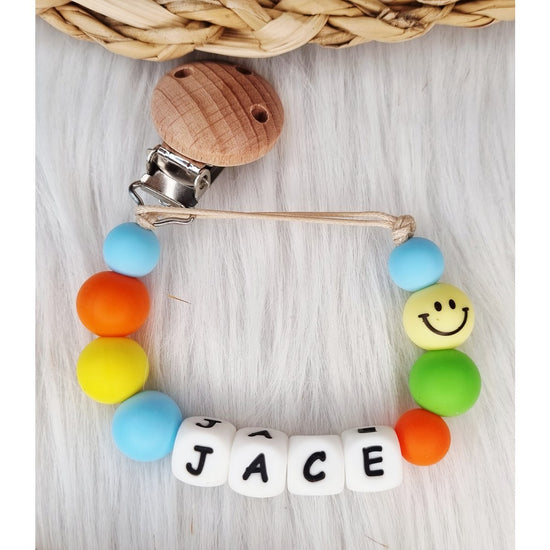 Speenkoord met naam Smiley babyblauw